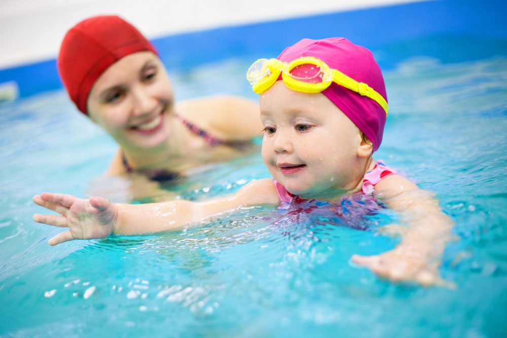 Baby Having Swimming Lesson